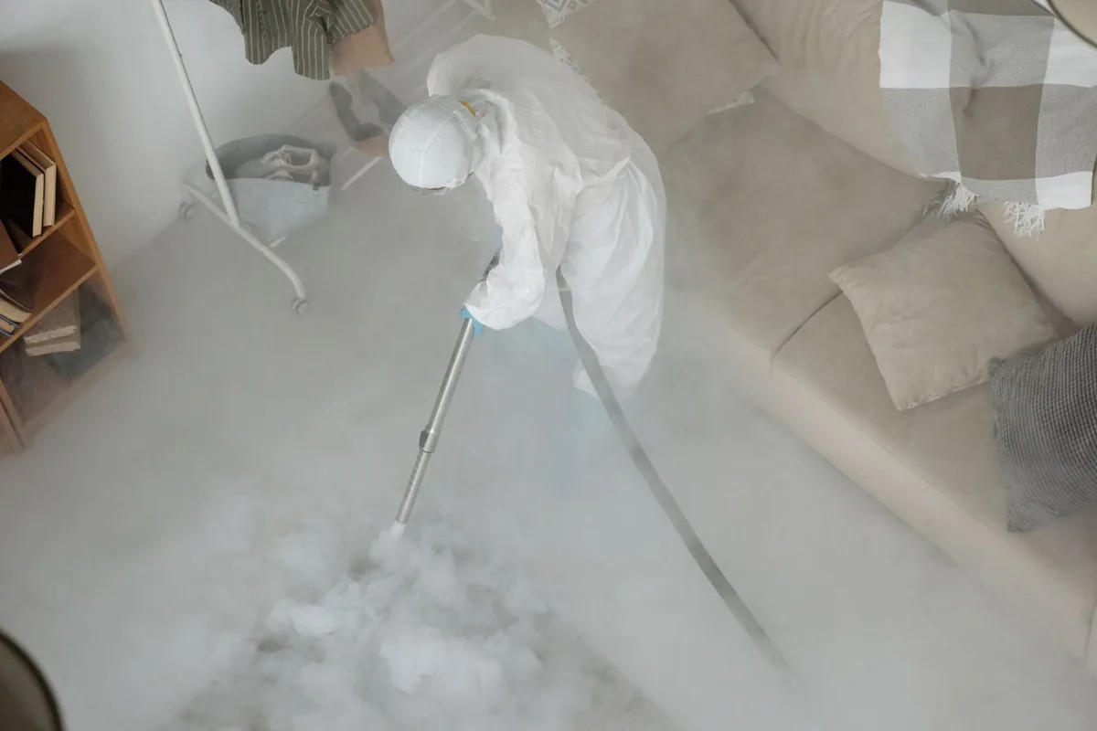 Biohazard cleanup technician in protective equipment, North Babylon, NY